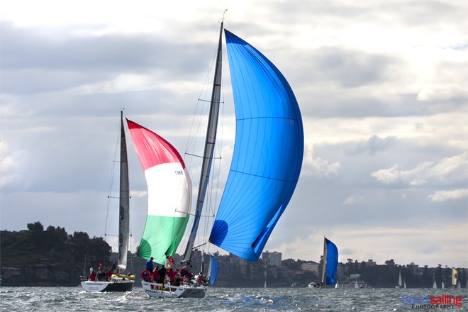 The sun lights up colourful kites such as Brannew’s as they sail down the harbour in last Sunday’s Audi Winter Series in Sydney.  - CYCA Audi Winter Series 2012 - Race 9  © Beth Morley - Sport Sailing Photography http://www.sportsailingphotography.com